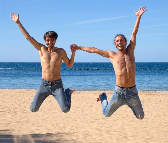 two gay travelers - best gay travel destinations in the world 2023