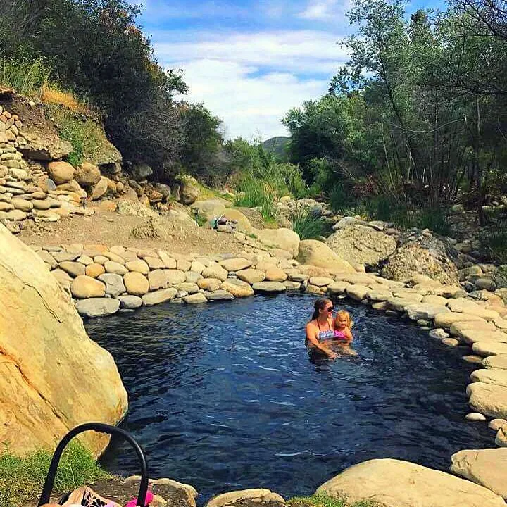 A woman in Ecotopia Ojai Hot Springs in California with a baby