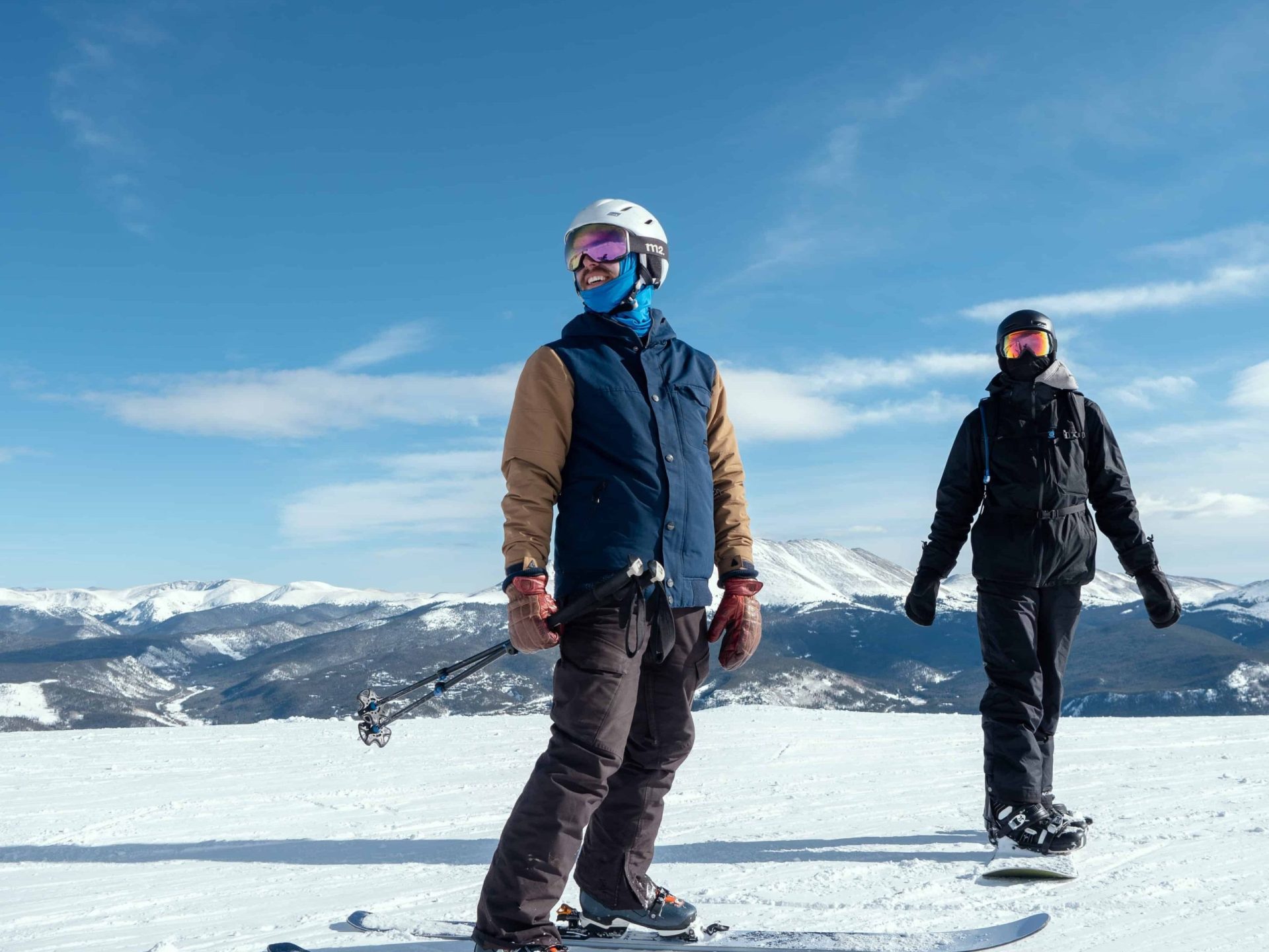 two gay travelers skiing in Denver - Best LGBTQ things to do in Denver in the wintertime